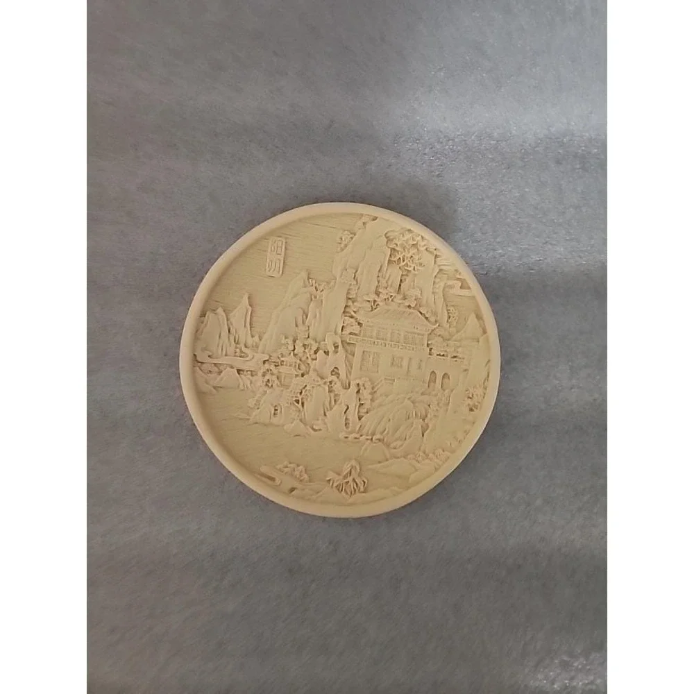 Vintage Chinese carved resin decorative plate with a landscape motif